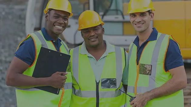Team of certified waste professionals in Cardiff wearing uniforms and safety gear