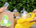 Recycling bins in Cardiff filled with sorted household waste like paper, plastic, and glass