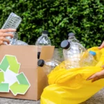 Recycling bins in Cardiff filled with sorted household waste like paper, plastic, and glass