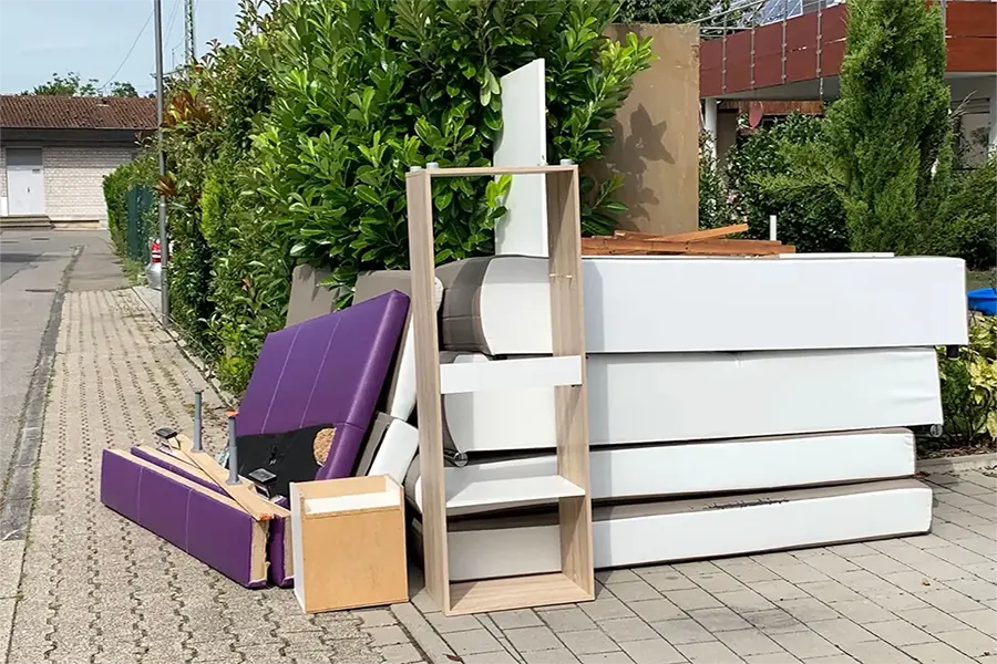 Cardiff waste removal truck collecting mixed residential and business waste